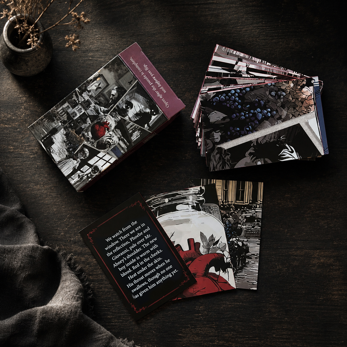 The Horrors Unearthed story cards: the deck box and the cards fanned out on a dark wooden table